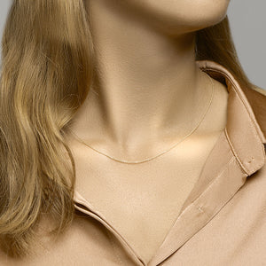 Verguld op 925 zilveren anker plat collier met een schakelbreedte van 1.1mm. Lengte verstelbaar, 41 + 4 cm. Geen garantie op plating.