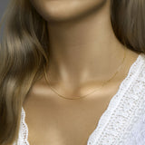 Verguld op 925 zilveren gourmette collier met een schakelbreedte van 1.2mm. Geen garantie op plating. Op model.